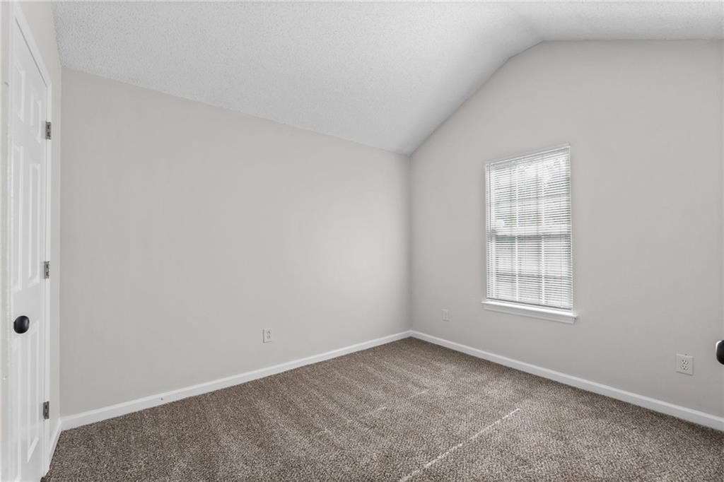 2921 Ward Lake Way Ellenwood, GA 30294 - Photo 19 of 25 an empty room with windows