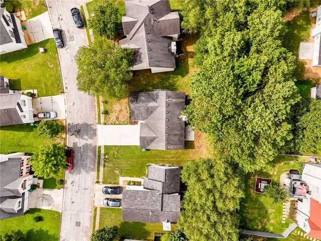 an aerial view of residential house with outdoor space and swimming pool
