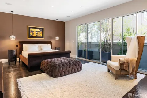 a bathroom with a granite countertop sink and a bathtub