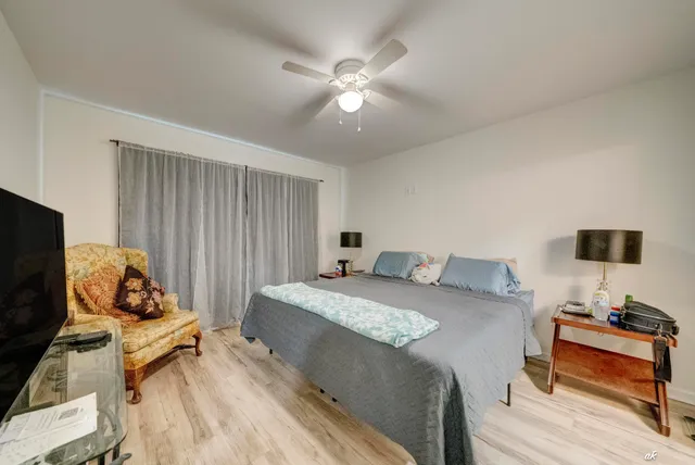 a bedroom with a bed and a tv