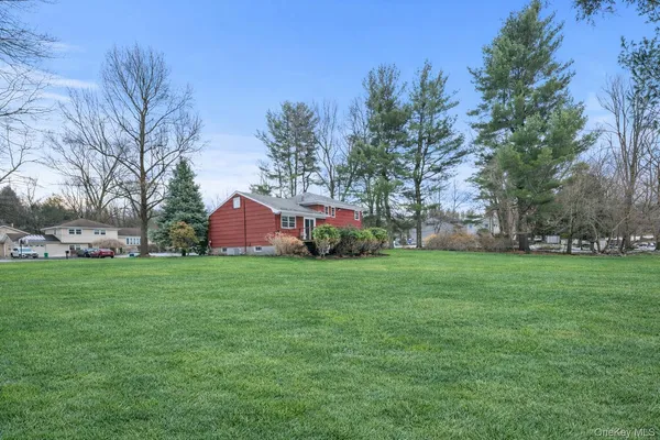 a backyard of a house with lots of green space