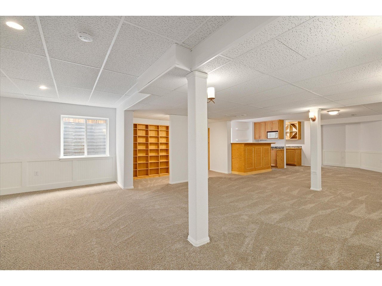 8145 Raspberry Drive Frederick, CO 80504 - Photo 26 of 46 Huge rec room with library behind