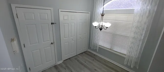 a view of a bathroom from a hallway