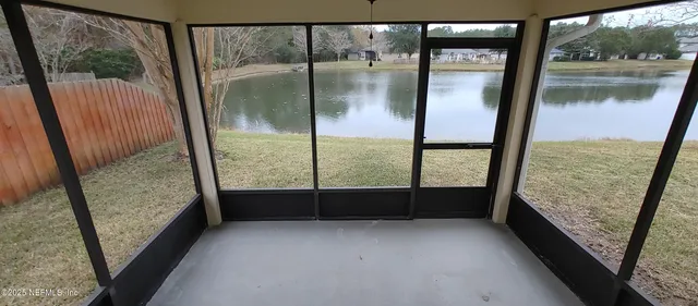 a view of a living room with fireplace and wooden floor