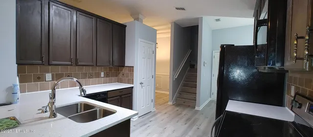 a bathroom with a toilet a sink and bathtub