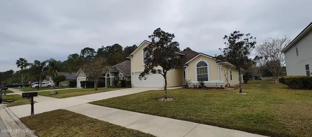 a front view of a house with a yard