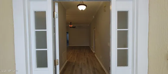 a view of a livingroom from a hallway