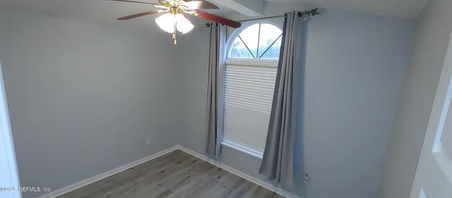 a view of an empty room and window