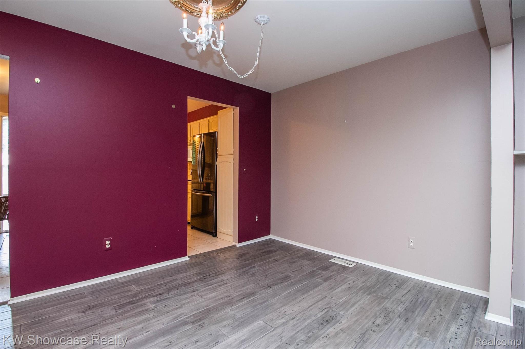 3656 Old Creek Road, Unit 134 Troy, MI 48084 - Photo 17 of 39 Dining room off of the kitchen with new gray hardwood flooring