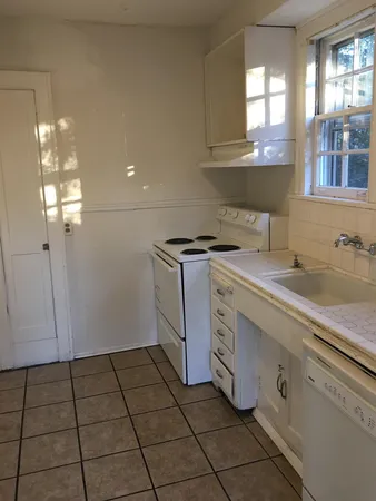 a kitchen with a sink and cabinets