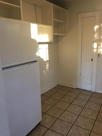 a view of a refrigerator in a kitchen