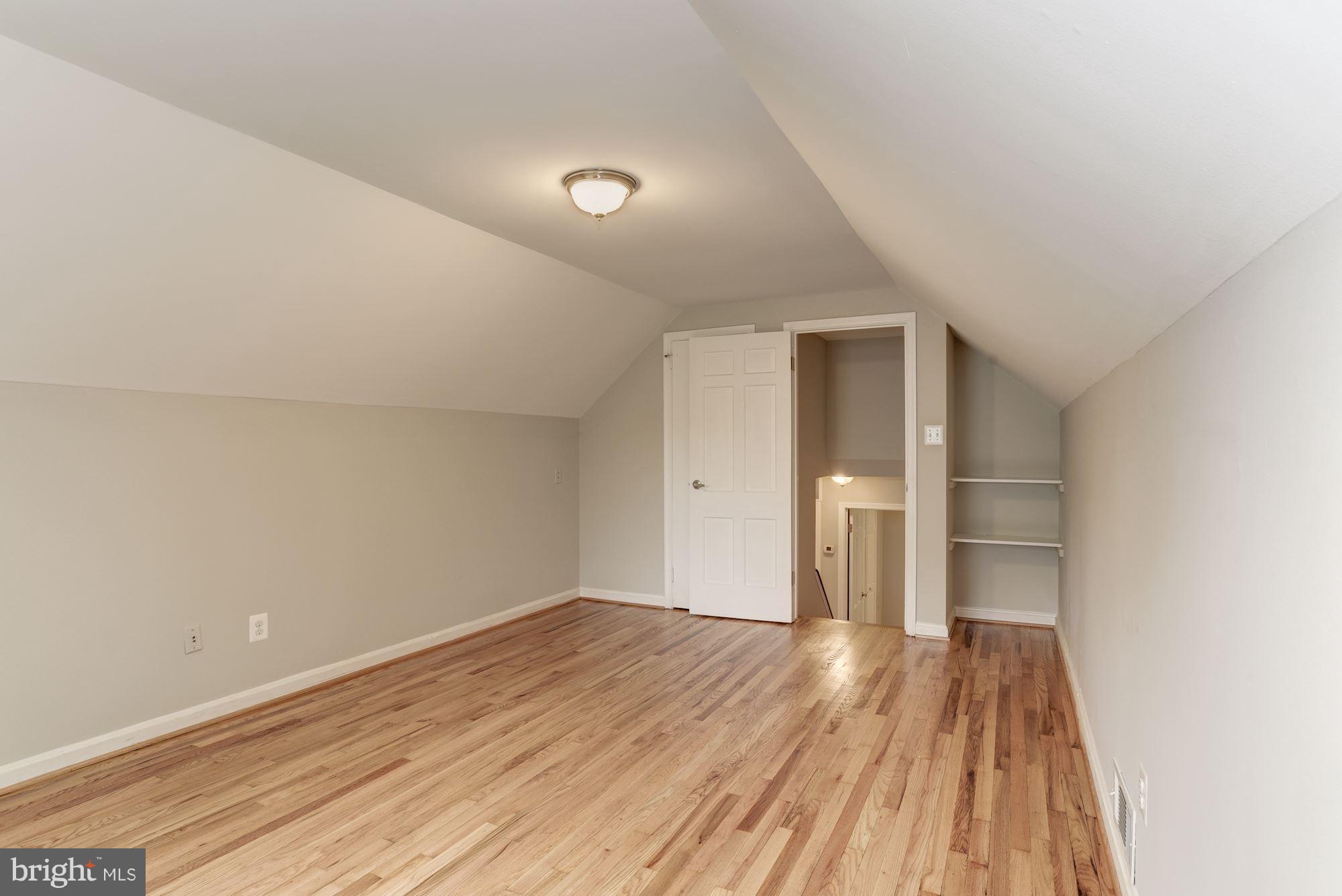 6916 Gilbert Street Springfield, VA 22150 - Photo 15 of 26 a view of a room with a wooden floor