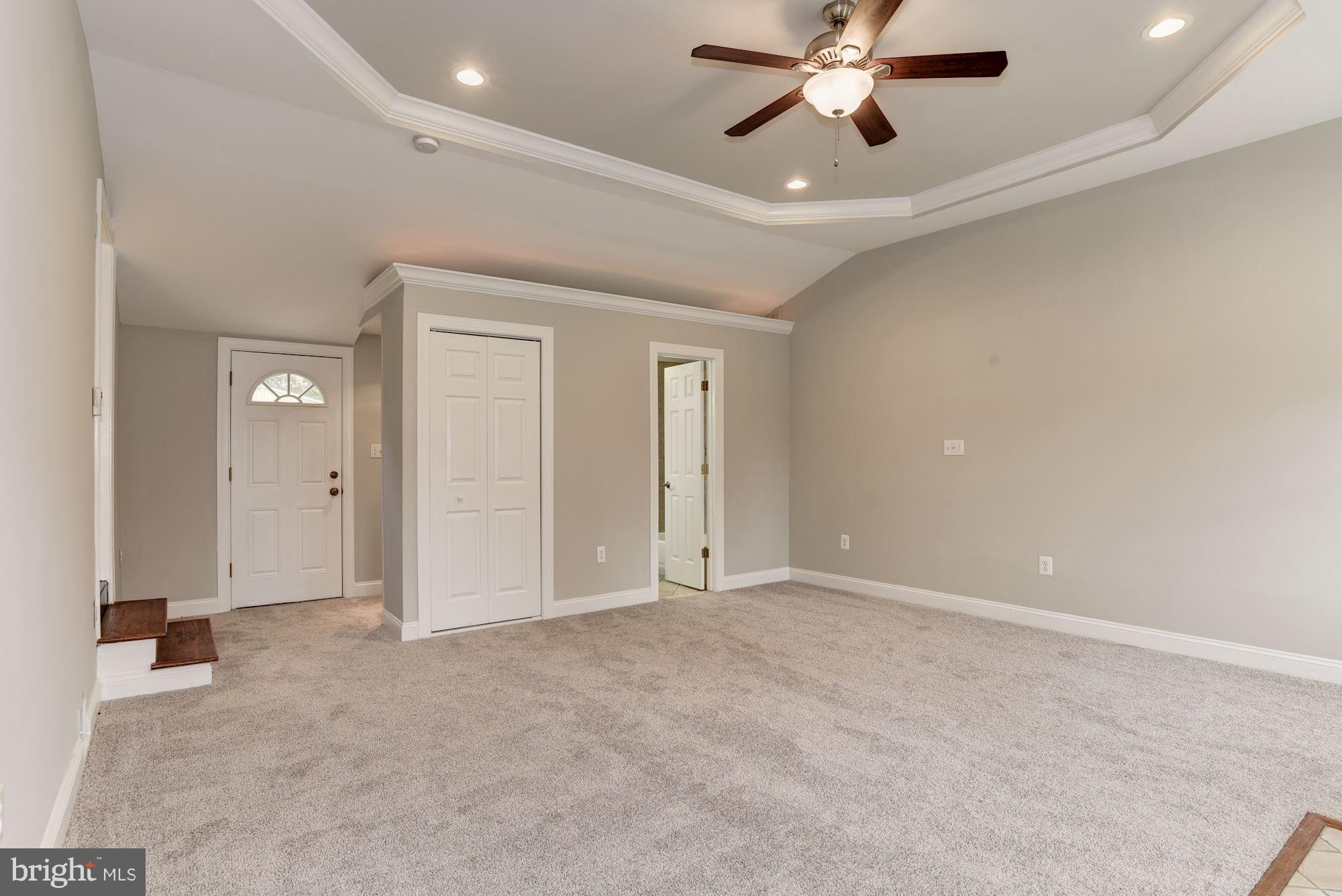 6916 Gilbert Street Springfield, VA 22150 - Photo 17 of 26 an empty room with chandelier fan