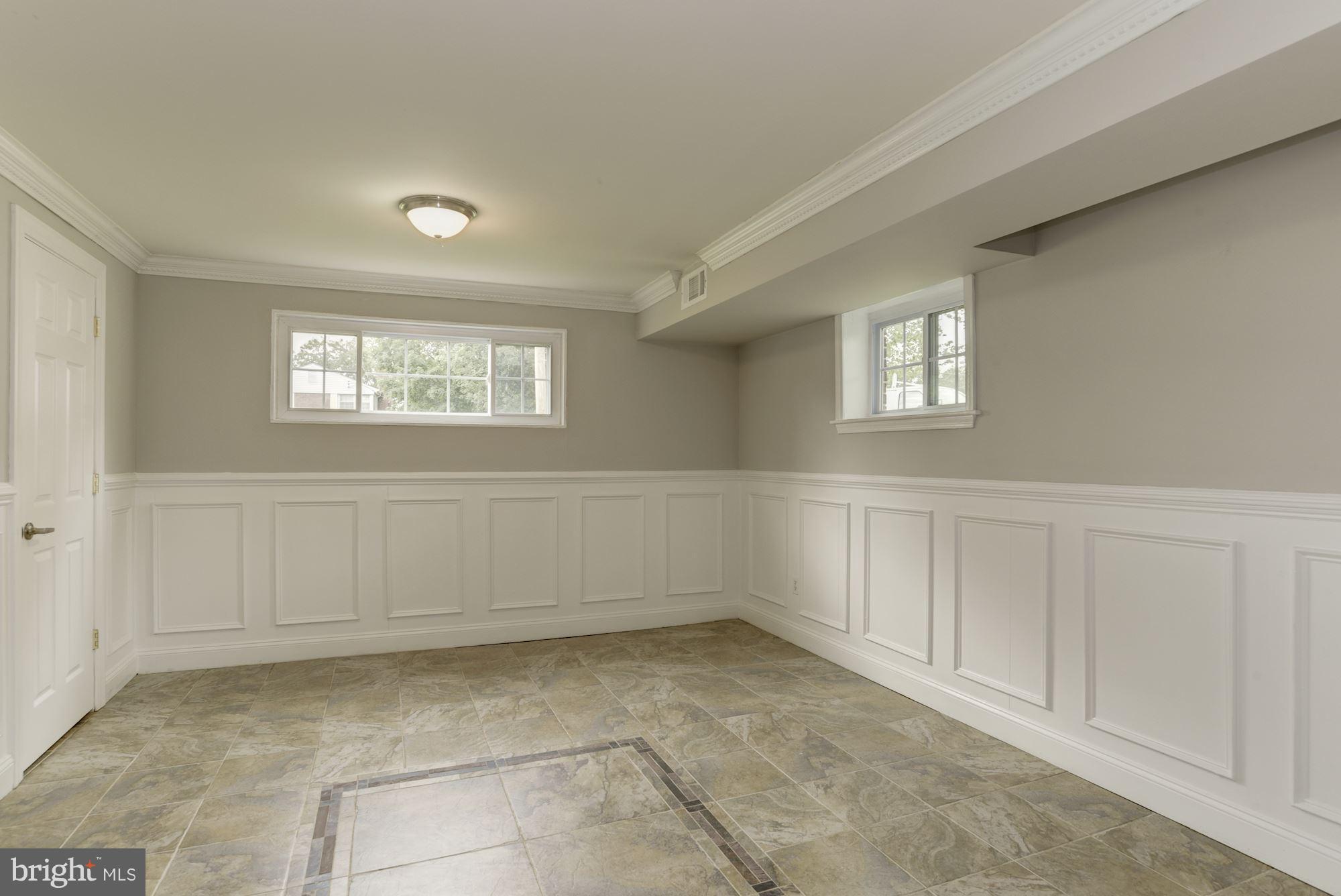 6916 Gilbert Street Springfield, VA 22150 - Photo 19 of 26 a view of an empty room with a window