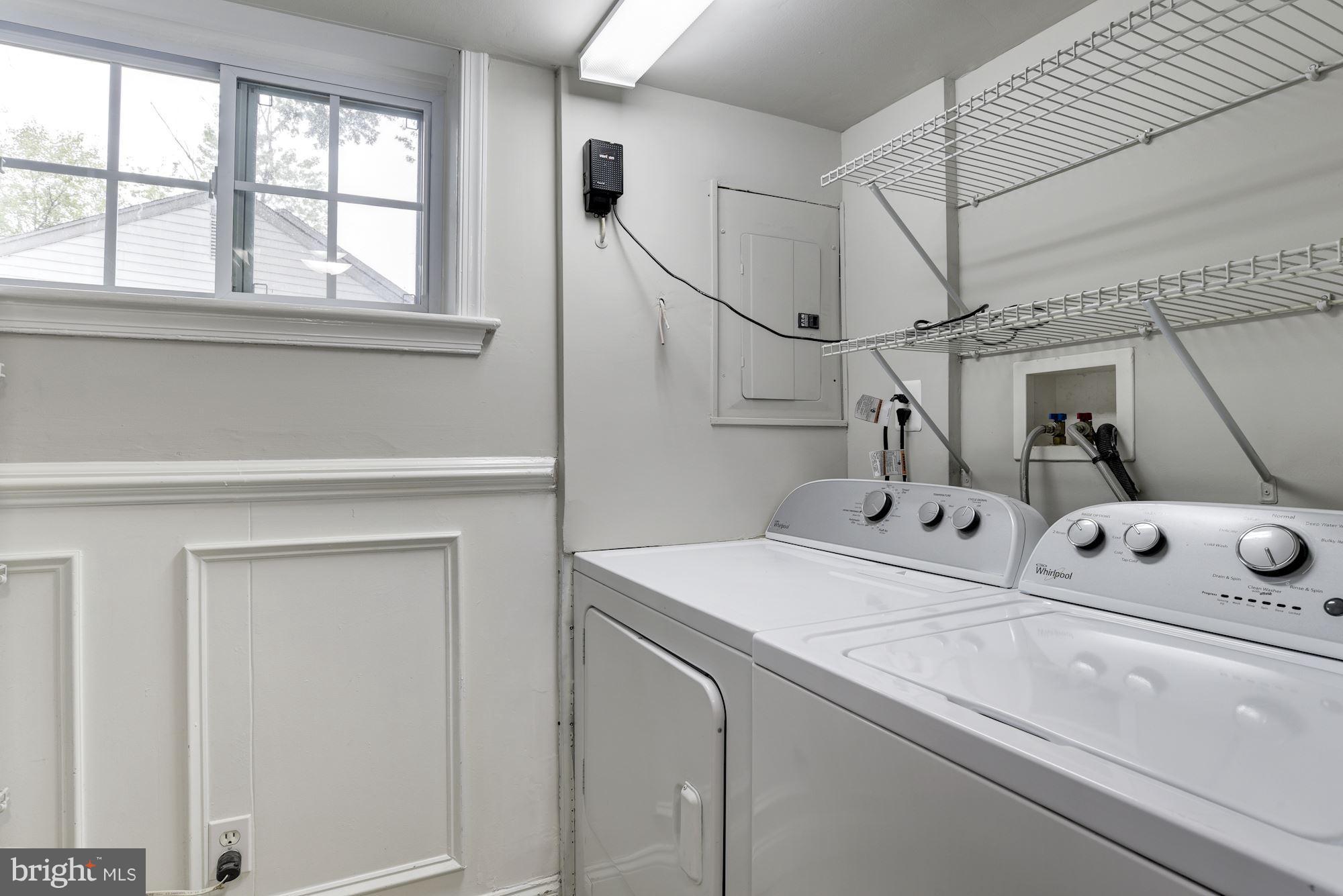 6916 Gilbert Street Springfield, VA 22150 - Photo 21 of 26 a utility room with dryer and washer