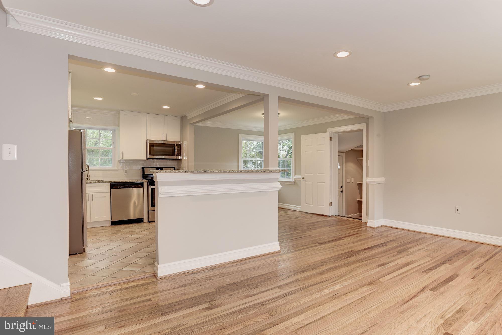 6916 Gilbert Street Springfield, VA 22150 - Photo 4 of 26 a view of kitchen with cabinets appliances and wooden floor