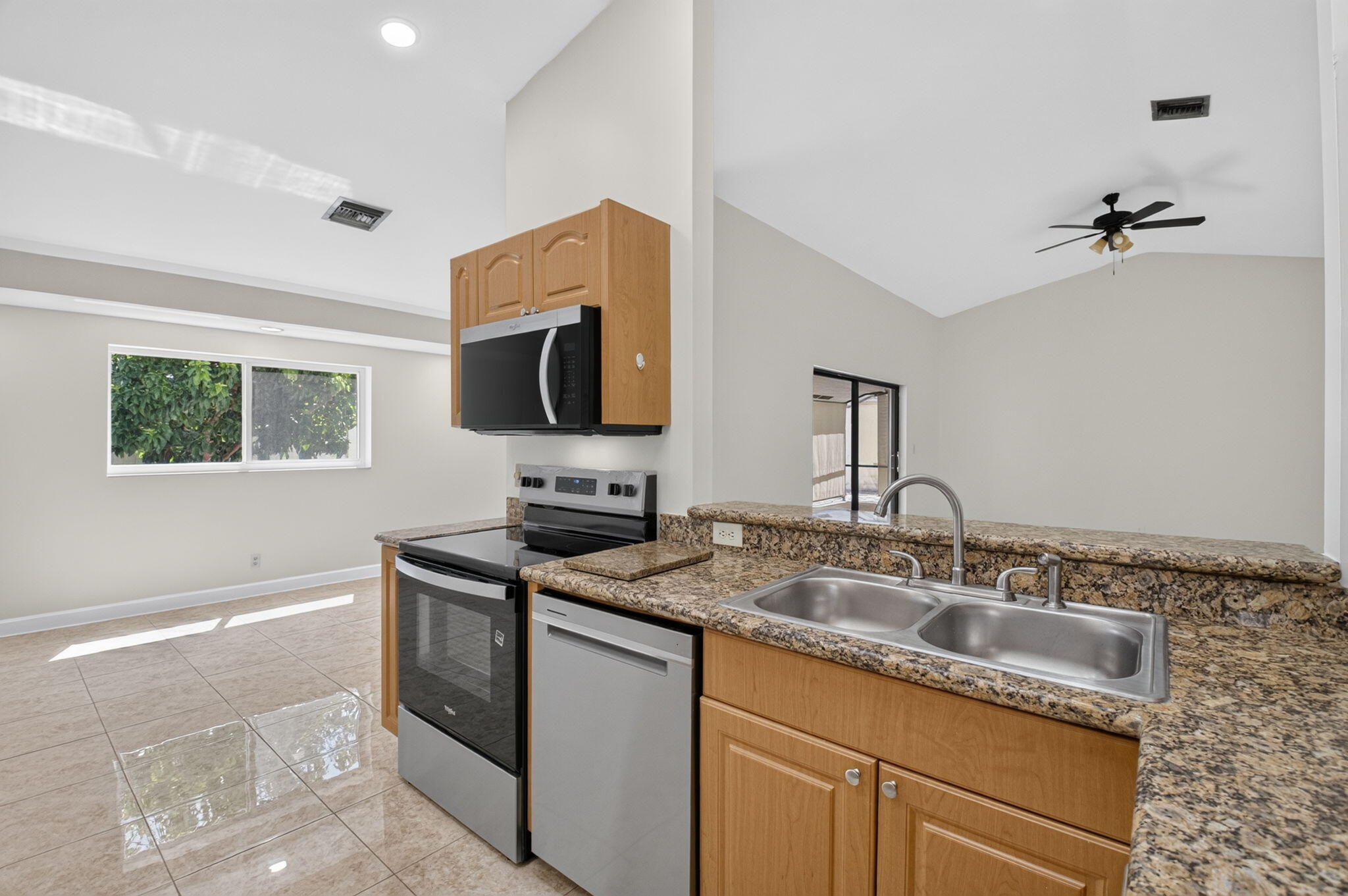 21070 Woodspring Avenue Boca Raton, FL 33428 - Photo 7 of 30 a kitchen with a sink appliances and cabinets