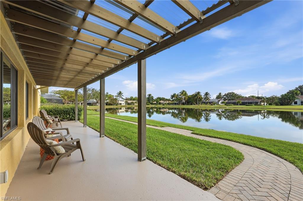 2274 Queens Way Naples, FL 34112 - Photo 27 of 28 a view of swimming pool with outdoor seating and yard