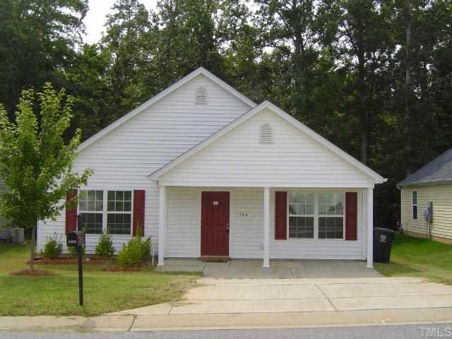 1504 Ricochet Drive Raleigh, NC 27610 - Photo 1 of 8 a front view of a house with a garden