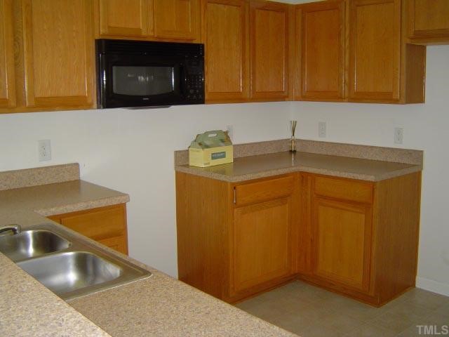 1504 Ricochet Drive Raleigh, NC 27610 - Photo 3 of 8 a utility room with dryer and washer