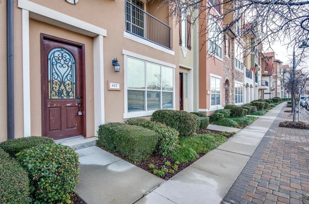 View of exterior entry featuring stucco siding
