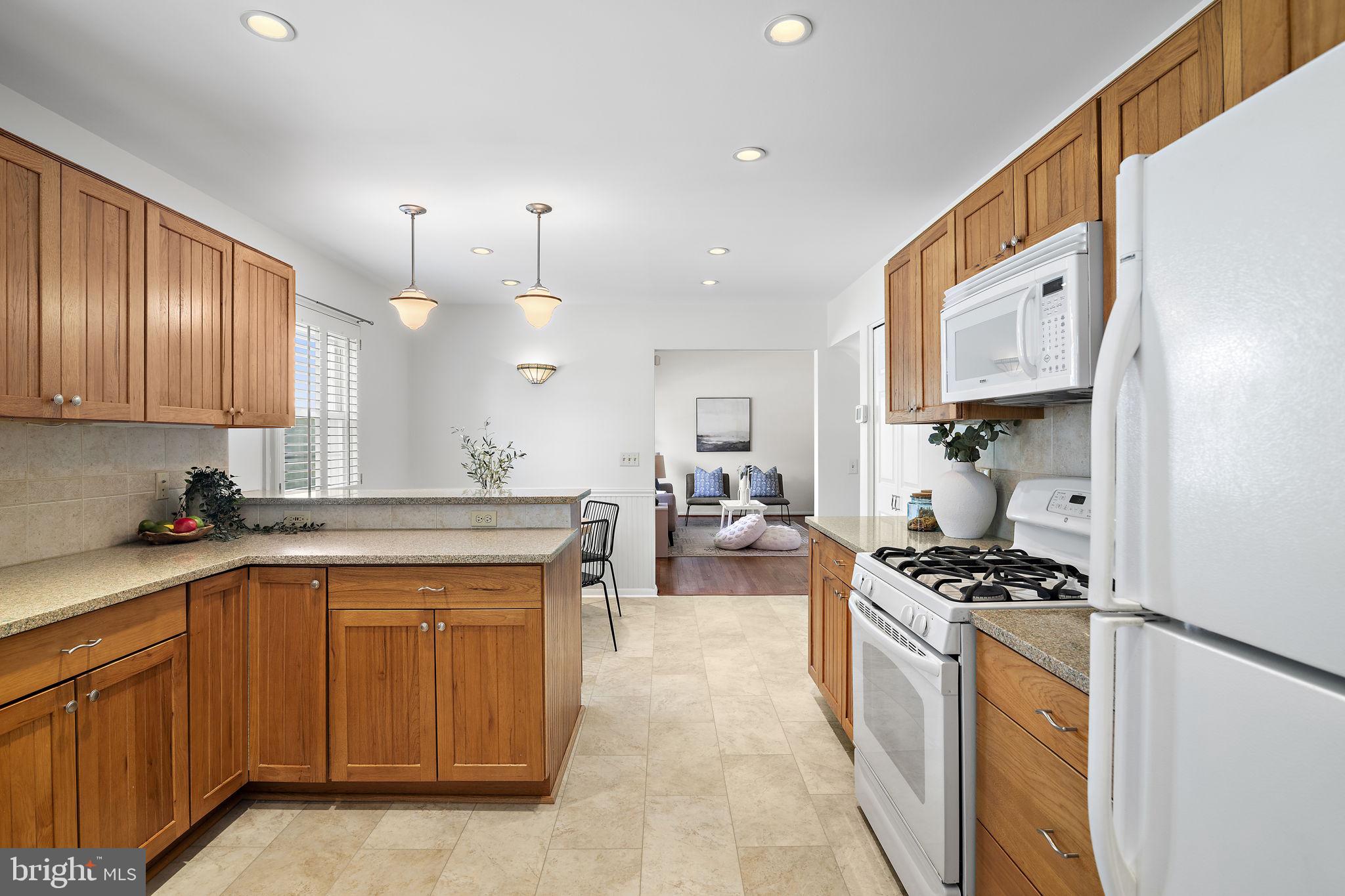 9004 Tammy Road Baltimore, MD 21236 - Photo 10 of 27 Inviting kitchen with warm wood tones.