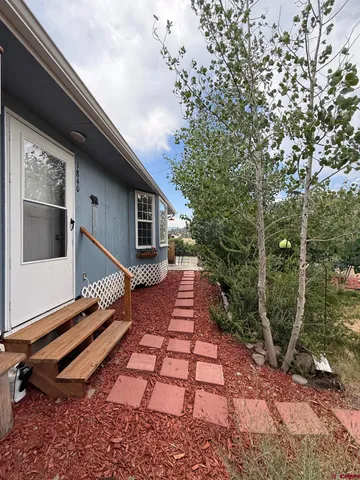 a house with trees in front of it