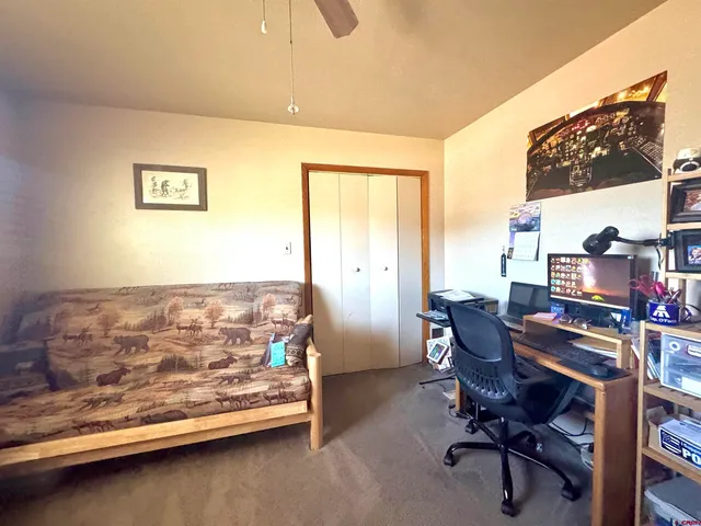 a view of a workspace with furniture