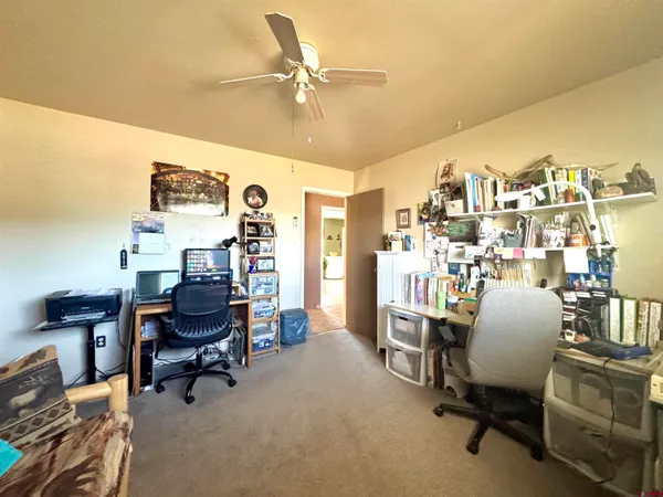 a bed room with furniture and a flat screen tv