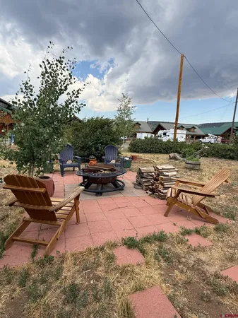 a view of a backyard with plants and a garden