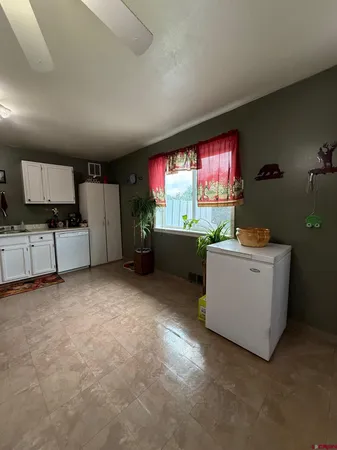 a room with furniture and a flat screen tv