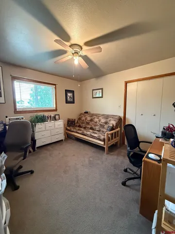 a bedroom with furniture and a window