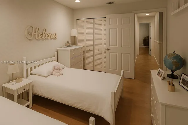 a bedroom with a bed and a table in it