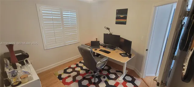 a workspace with furniture and a window