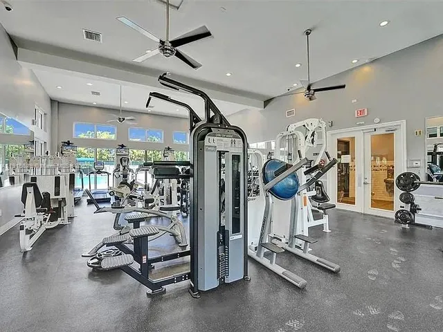 a view of yard with table and chairs under an umbrella