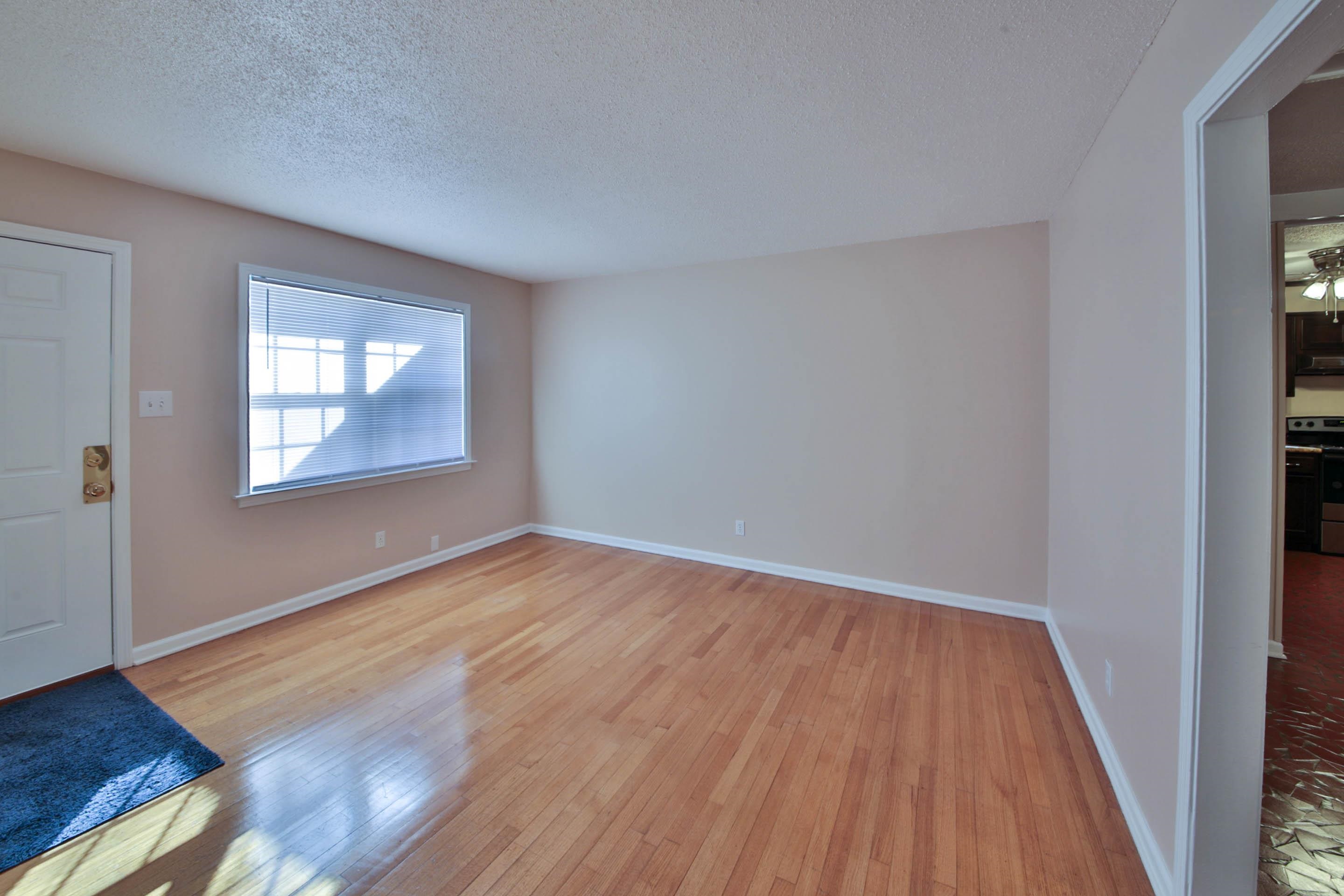 1820 West Holmes Road Memphis, TN 38109 - Photo 12 of 28 Foyer with a textured ceiling and light wood-style floors