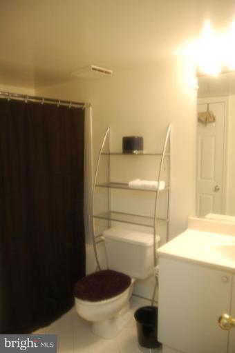 20600 Cornstalk Terrace, Unit 202 Ashburn, VA 20147 - Photo 5 of 12 a bathroom with a shower