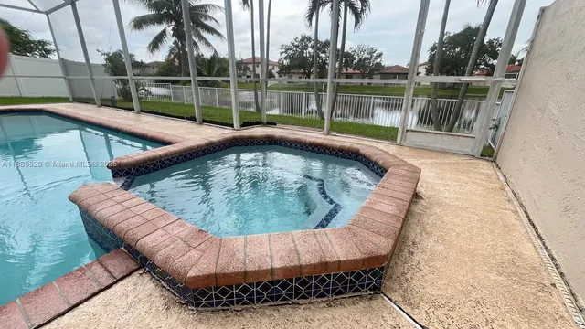 a view of a backyard with sitting area