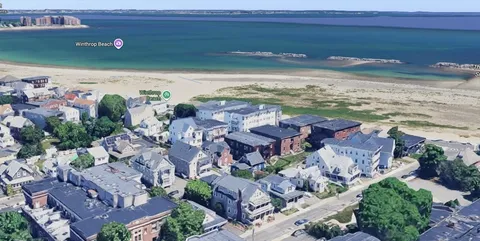 a view of a city with an ocean