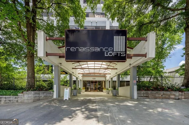 a view of a house with a tree