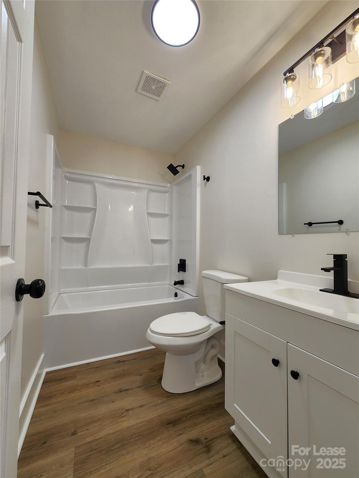 315 Hamilton Drive Northeast, Unit 5 Concord, NC 28025 - Photo 16 of 24 a bathroom with a bathtub sink mirror and toilet
