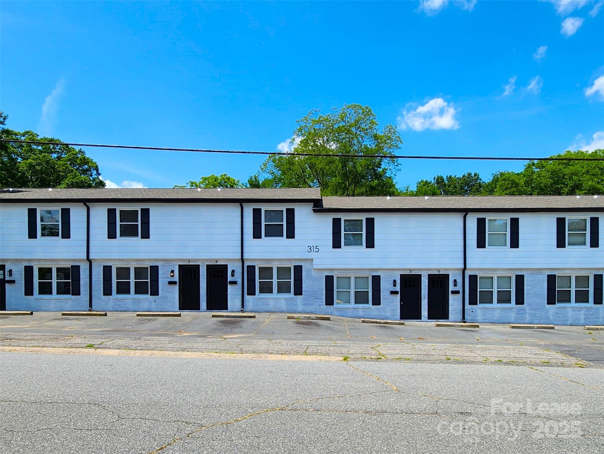 315 Hamilton Drive Northeast, Unit 5 Concord, NC 28025 - Photo 2 of 24 front view of a house with a yard