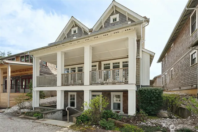 a view of a big building next to a yard