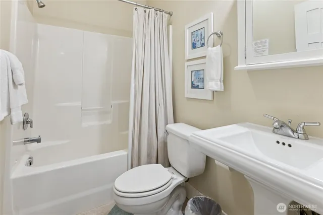 a bathroom with a sink toilet and bathtub