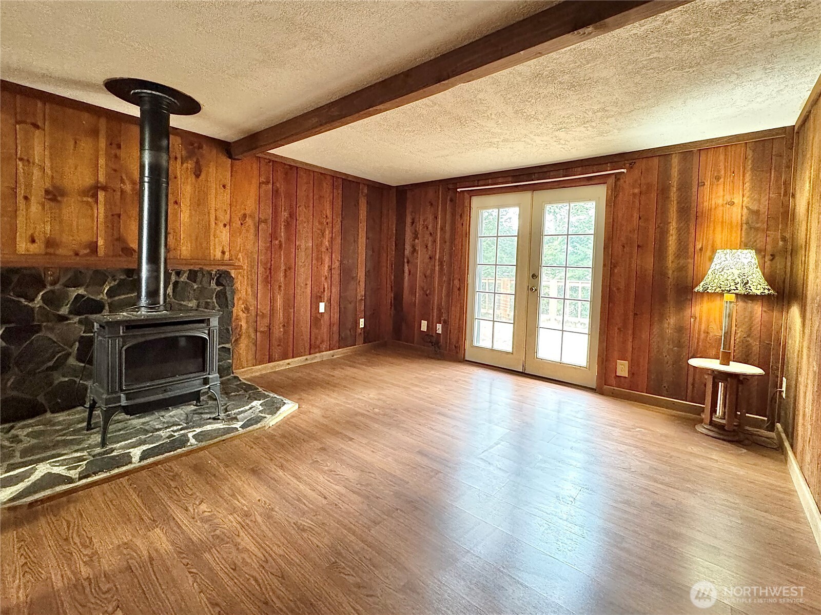 187 Wildcat Road Toutle, WA 98649 - Photo 4 of 21 an empty room with furniture and a fireplace