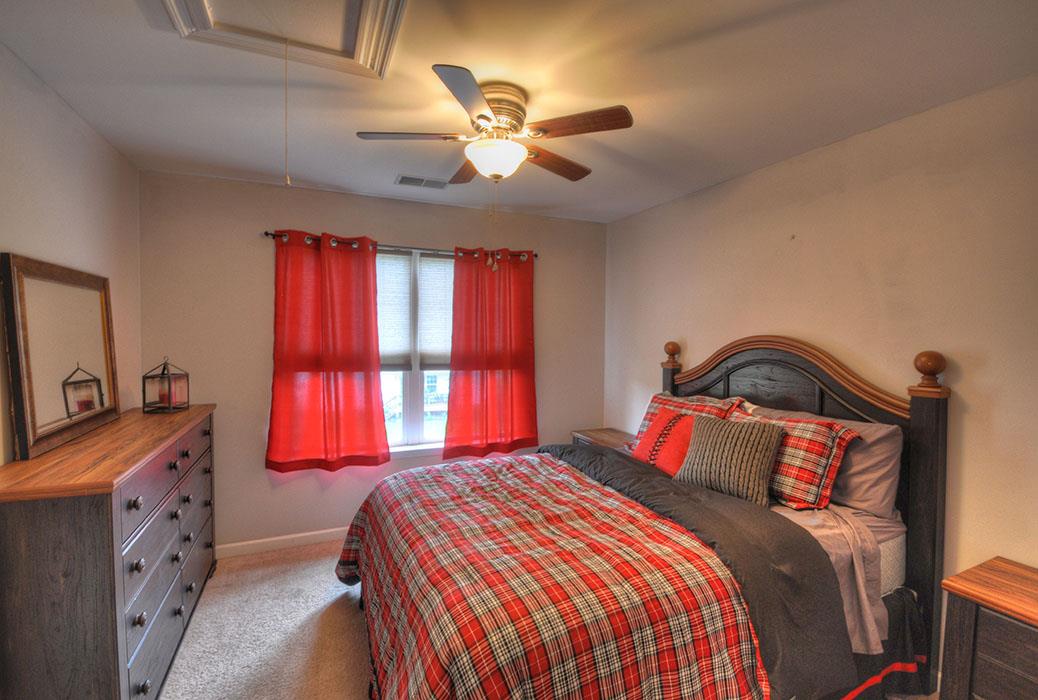 1103 Centerville Road Lebanon, TN 37087 - Photo 21 of 30 a bedroom with a bed and a chandelier