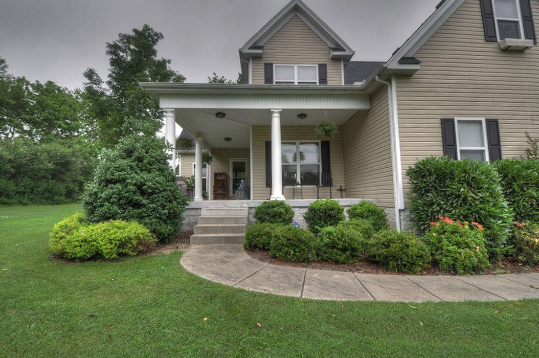 1103 Centerville Road Lebanon, TN 37087 - Photo 29 of 30 a front view of a house with a garden