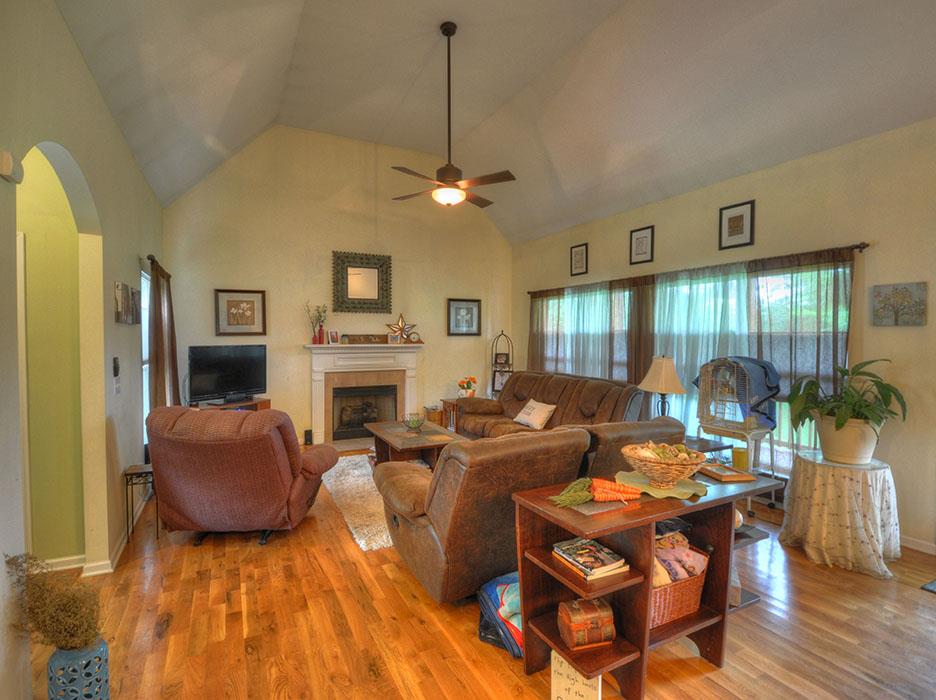 1103 Centerville Road Lebanon, TN 37087 - Photo 7 of 30 a living room with fireplace furniture and a chandelier