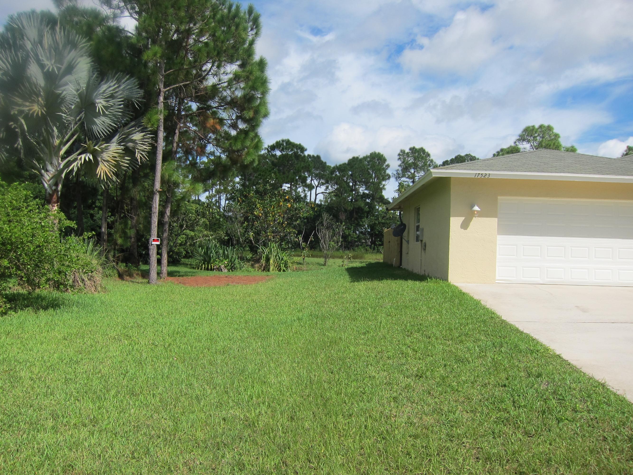 17523 82nd Road North Loxahatchee, FL 33470 - Photo 3 of 33 Left side of House