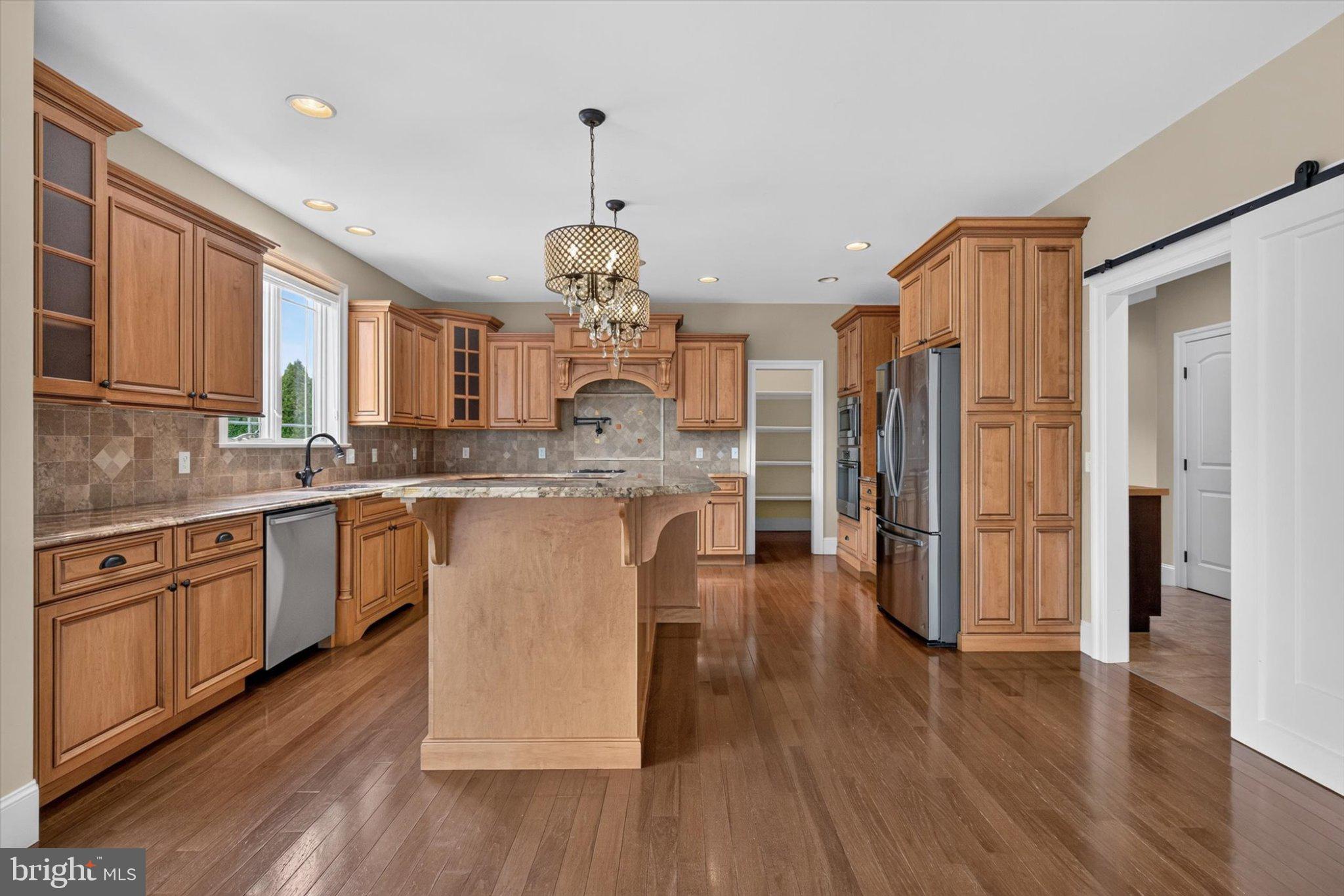 6505 Plowman Ridge Harrisburg, PA 17112 - Photo 17 of 83 Elegant kitchen with warm wood tones.